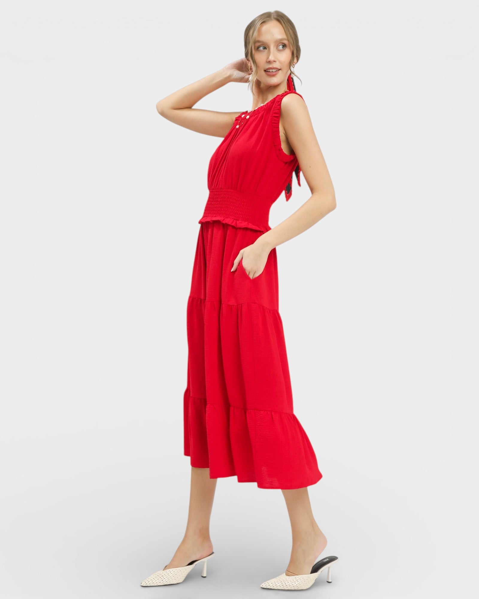 Woman wearing a red dress on a white background