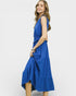 Woman wearing a blue dress on a white background