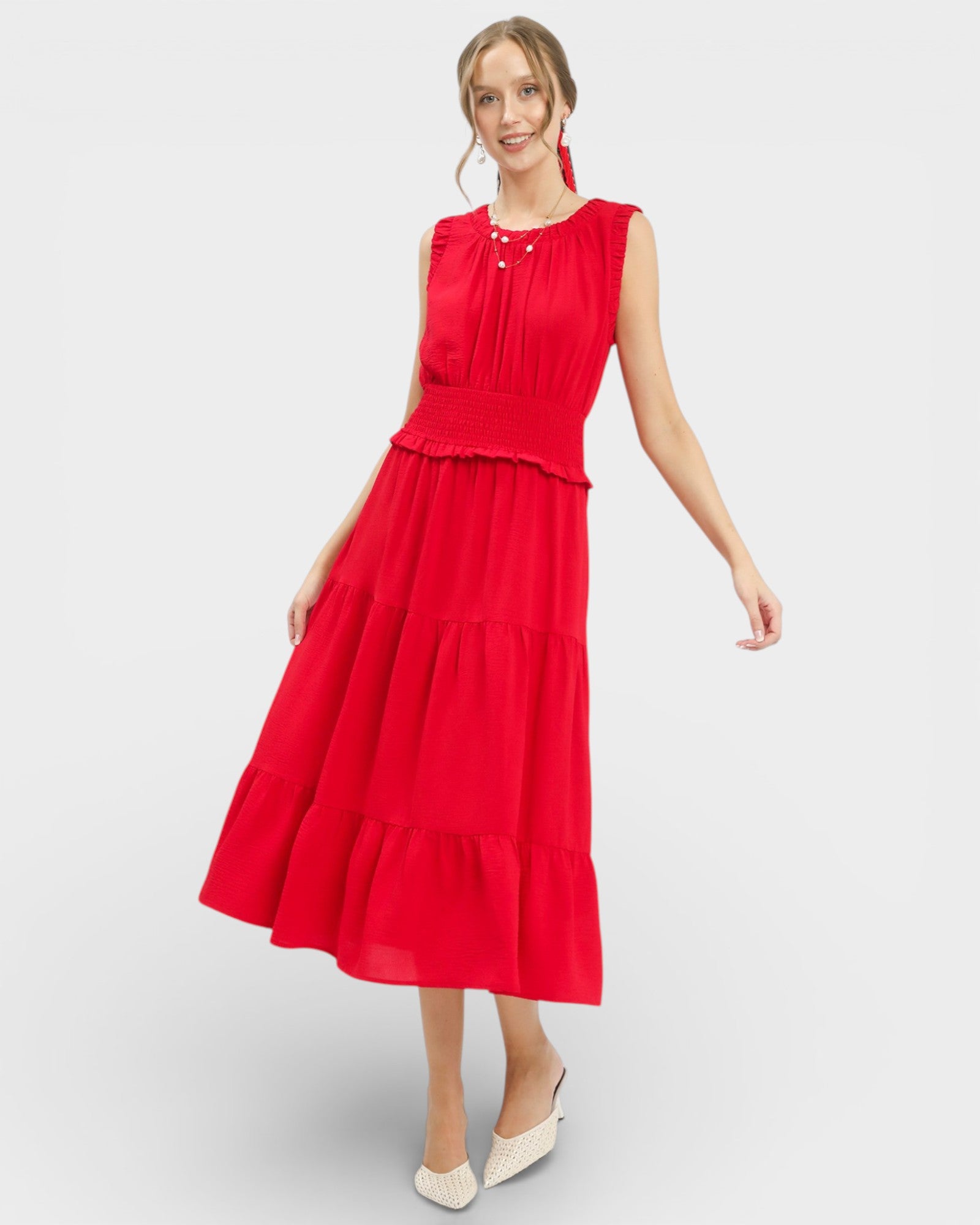 Woman wearing a red dress on a white background