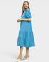 Woman wearing a blue dress on a white background