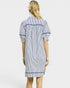 Woman wearing a blue and white striped dress on a plain background