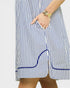 Blue and white striped dress with a pocket on a plain background