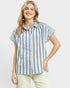 Woman wearing a blue and white striped shirt on a plain background