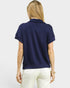 Person wearing a navy blue polo shirt on a white background