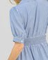Blue and white striped dress with a plain background