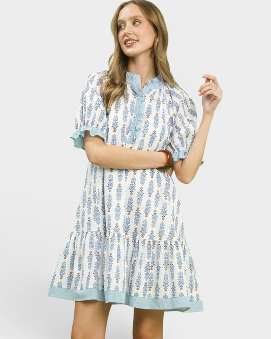 Woman wearing a floral dress with a white background