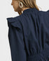 Navy blue textured dress with ruffled collar on a white background