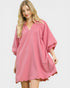 Woman wearing a pink dress on a white background