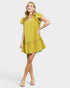 Woman wearing a yellow dress on a white background