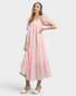 Woman wearing a pink dress on a white background