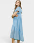 Woman wearing a light blue dress on a white background