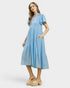 Woman wearing a blue dress on a white background