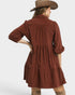 Woman wearing a brown dress with a hat on a white background