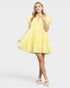 Woman wearing a yellow dress on a white background