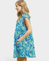 Woman wearing a blue floral dress on a white background
