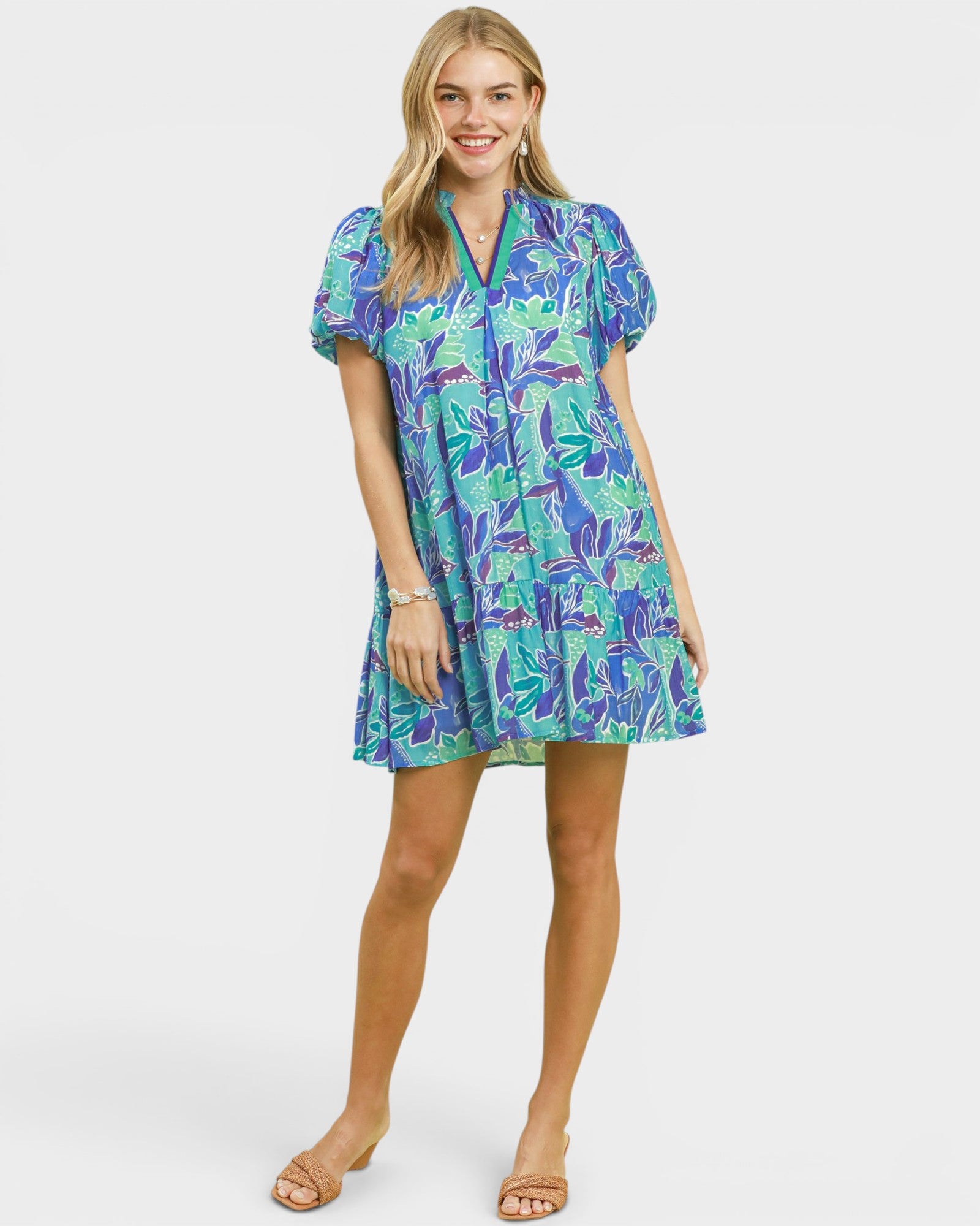 Woman wearing a colorful dress with a white background