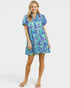 Woman wearing a colorful dress with a white background