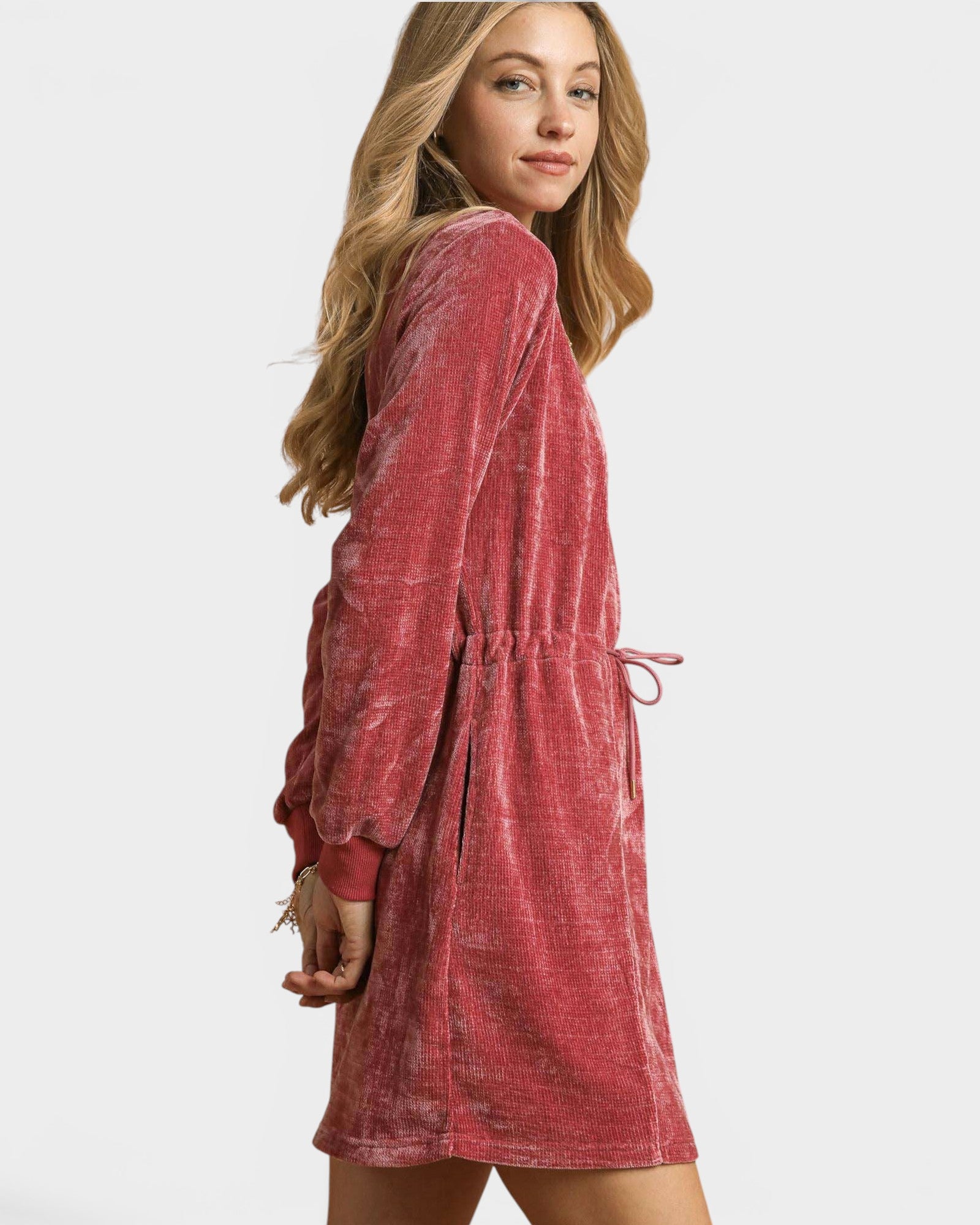 Woman wearing a red dress on a white background