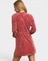 Red velvet dress worn by a person on a white background