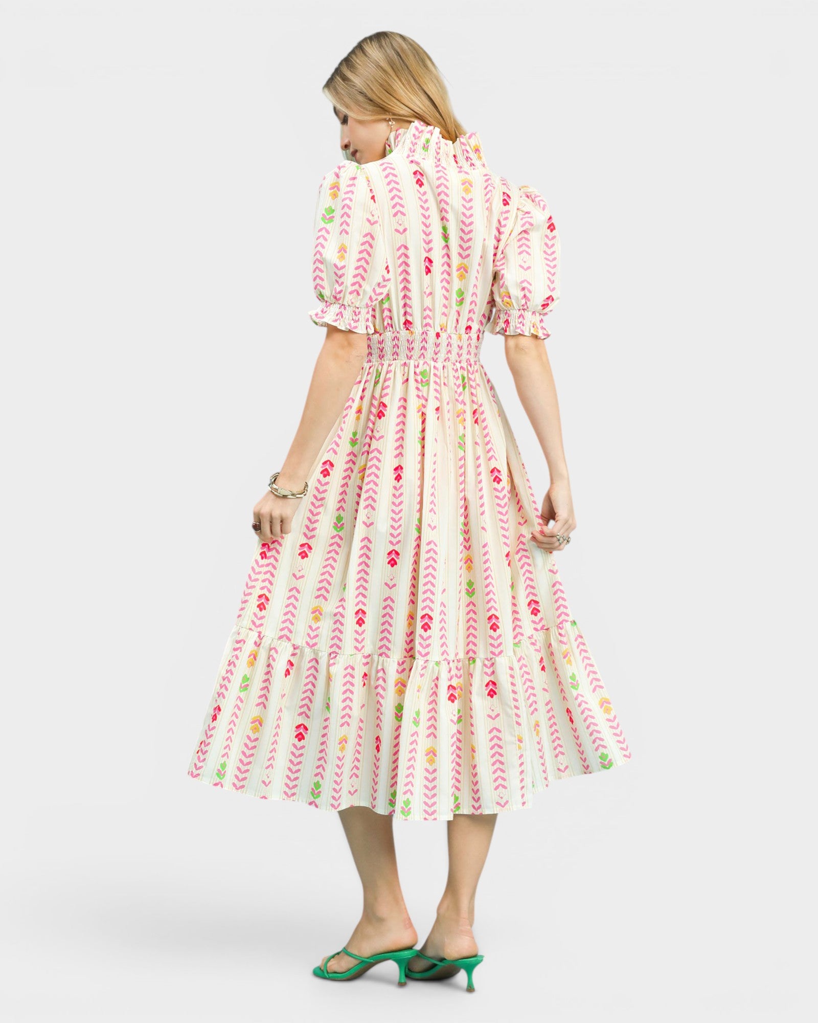 Woman wearing a floral dress on a white background