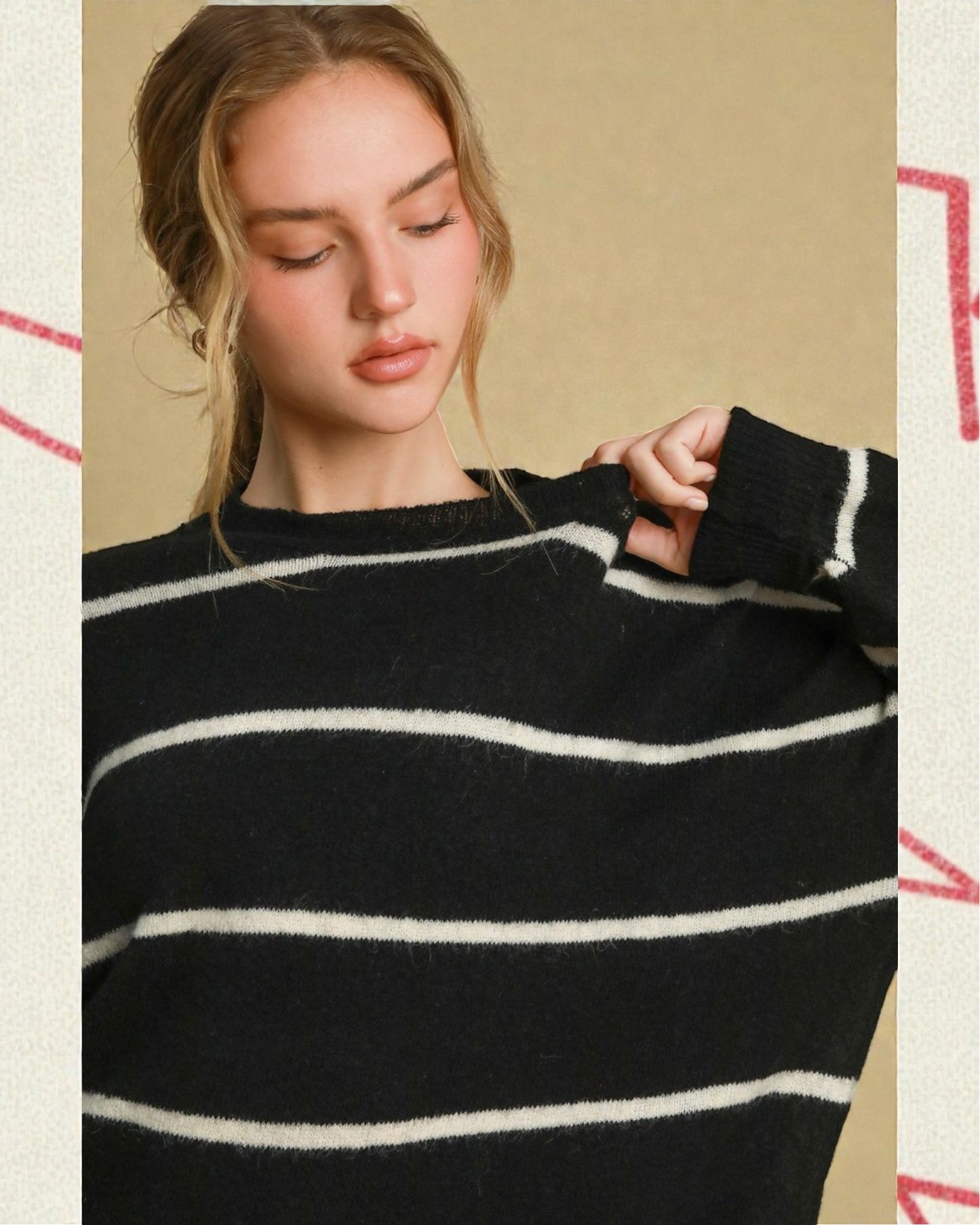 Person wearing a black and white striped sweater against a beige background