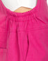 Close-up of a bright pink garment with an elasticized gathered neckline, shown on a mannequin or dress form against a white background.