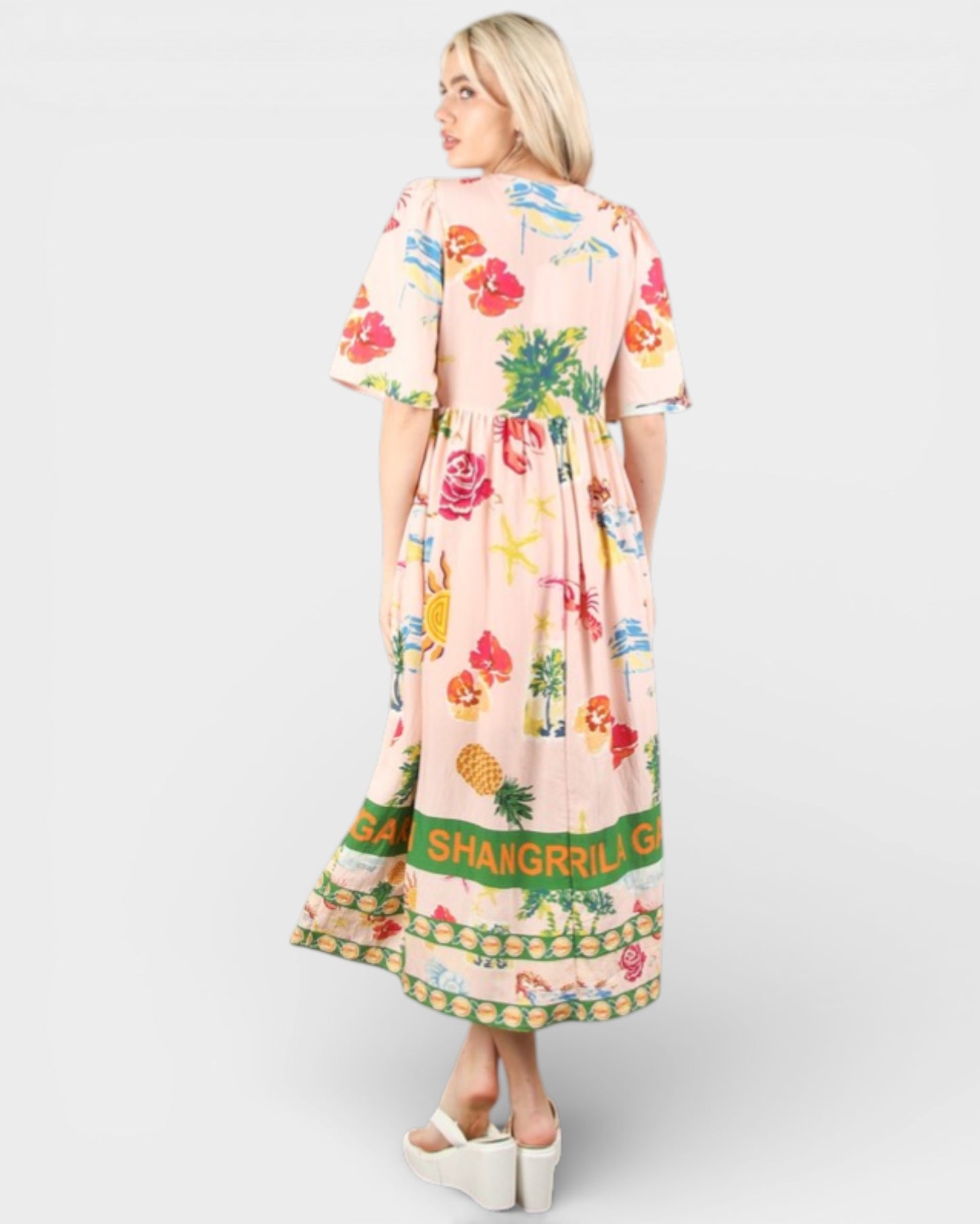 Woman wearing a floral dress with 'Shangrila Girl' text on a white background