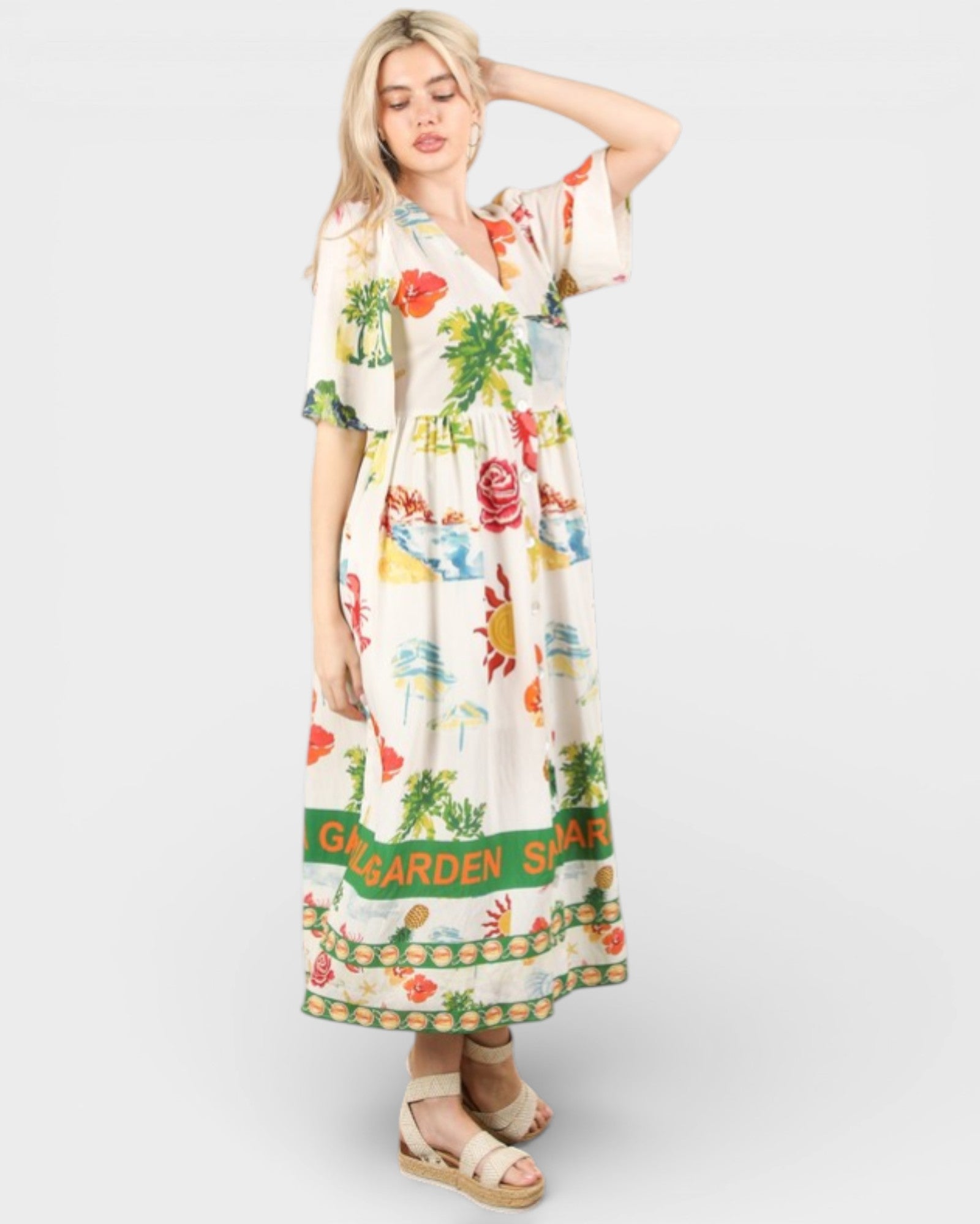 Woman wearing a floral dress with 'Shangri La Garden' text on a white background