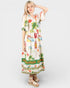 Woman wearing a floral dress with 'Shangri La Garden' text on a white background