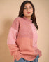 Woman wearing a pink and peach sweater against a beige background