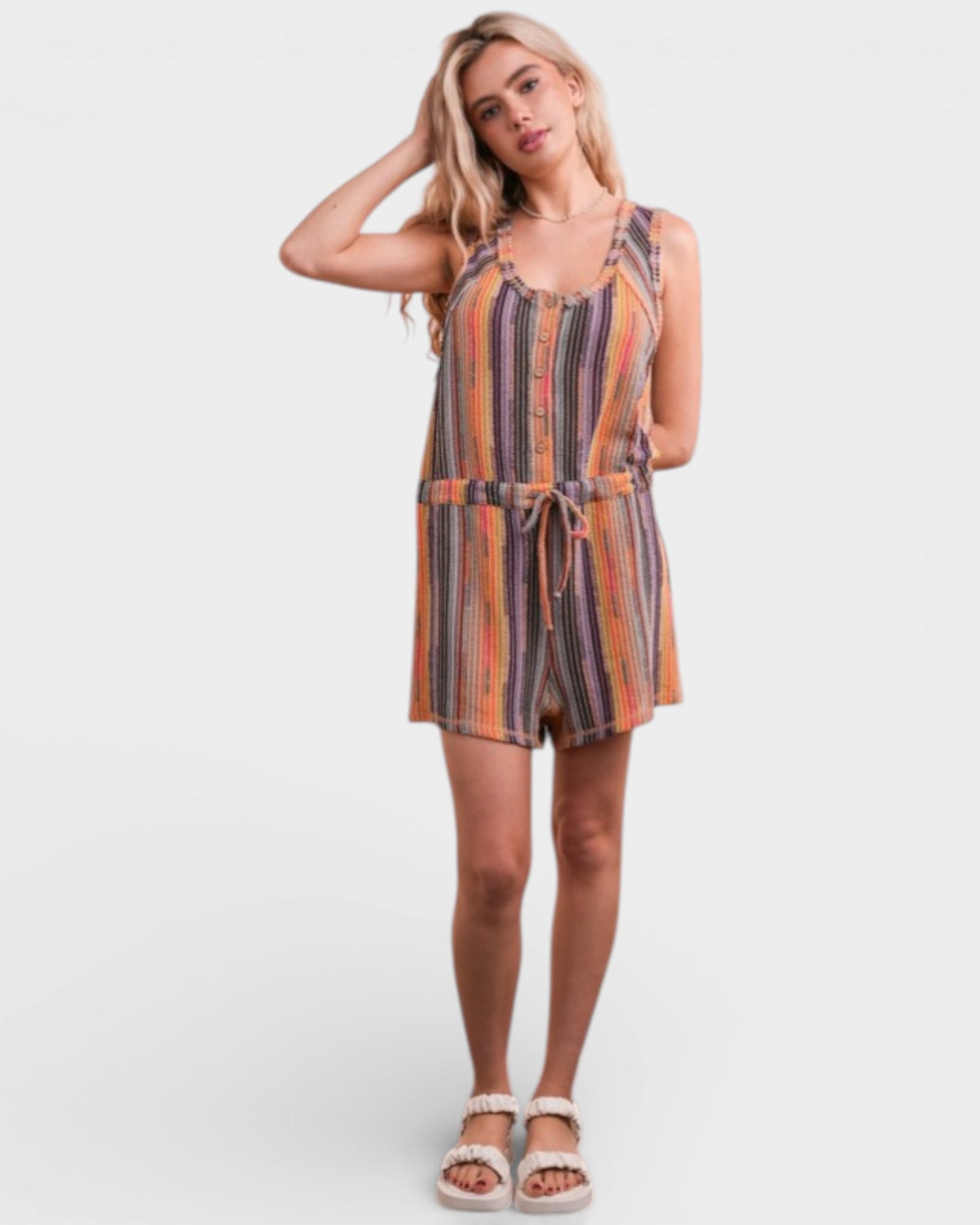 Woman wearing a striped dress on a white background