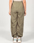 Person wearing olive green pants on a white background