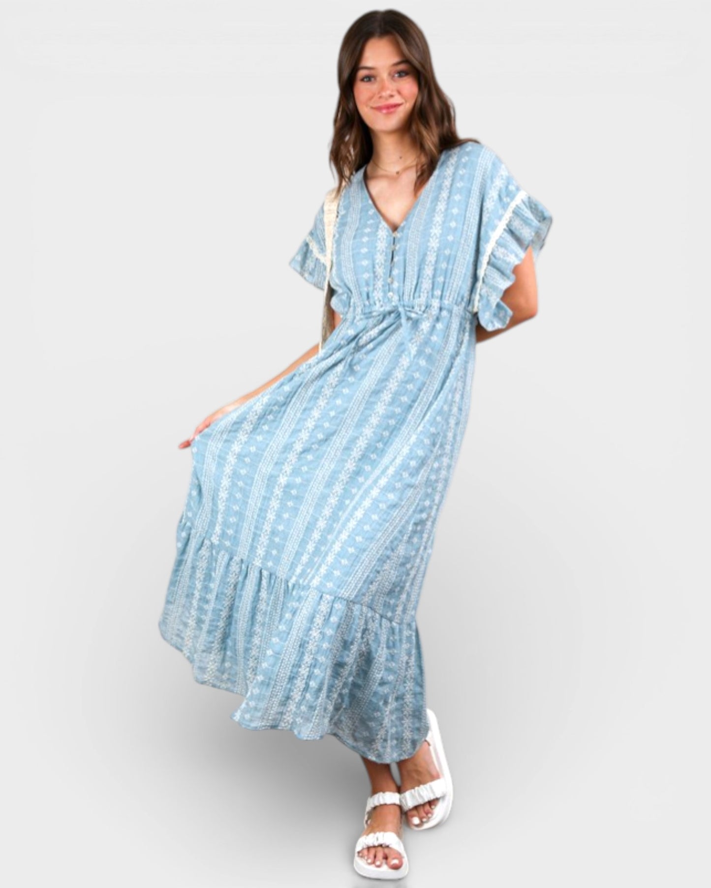 Woman wearing a blue striped dress on a white background