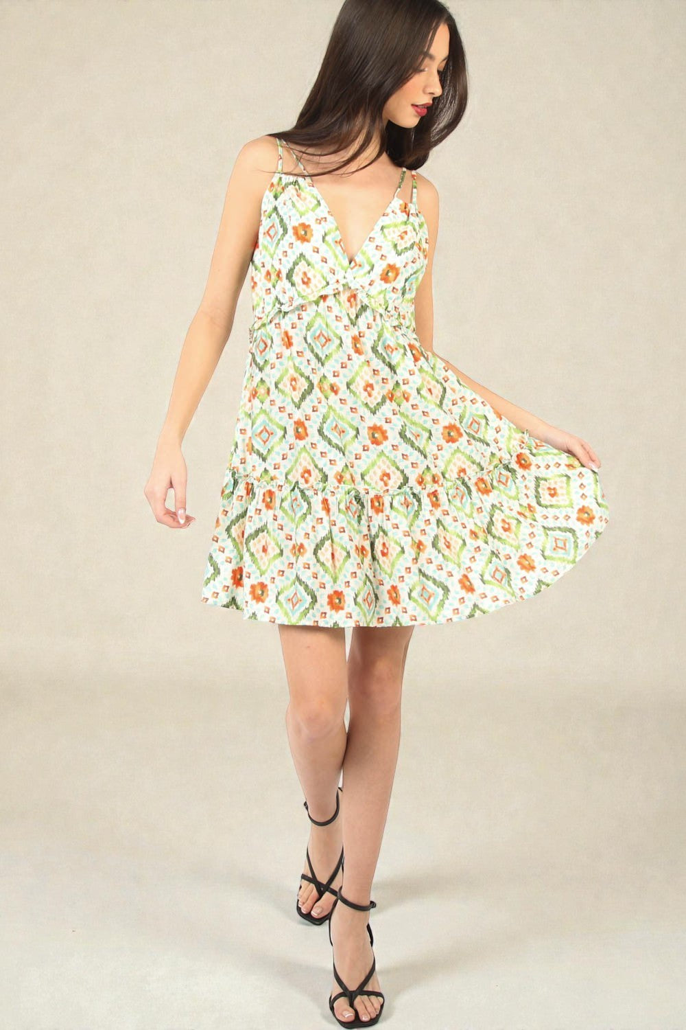 Woman wearing a floral dress on a beige background