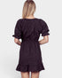 Black floral dress worn by a person on a white background