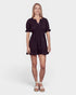 Woman wearing a black dress on a white background