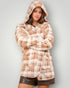 Person wearing a plaid hoodie with a plain background
