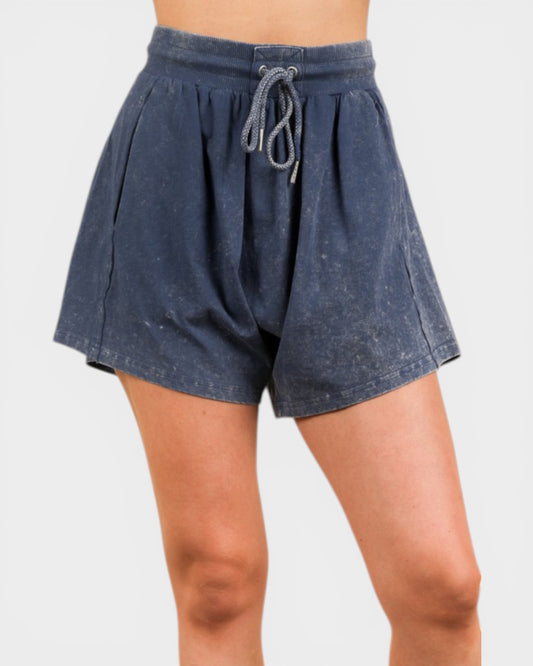 Blue shorts with a drawstring on a white background