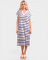 Woman wearing a blue and white striped dress on a plain background