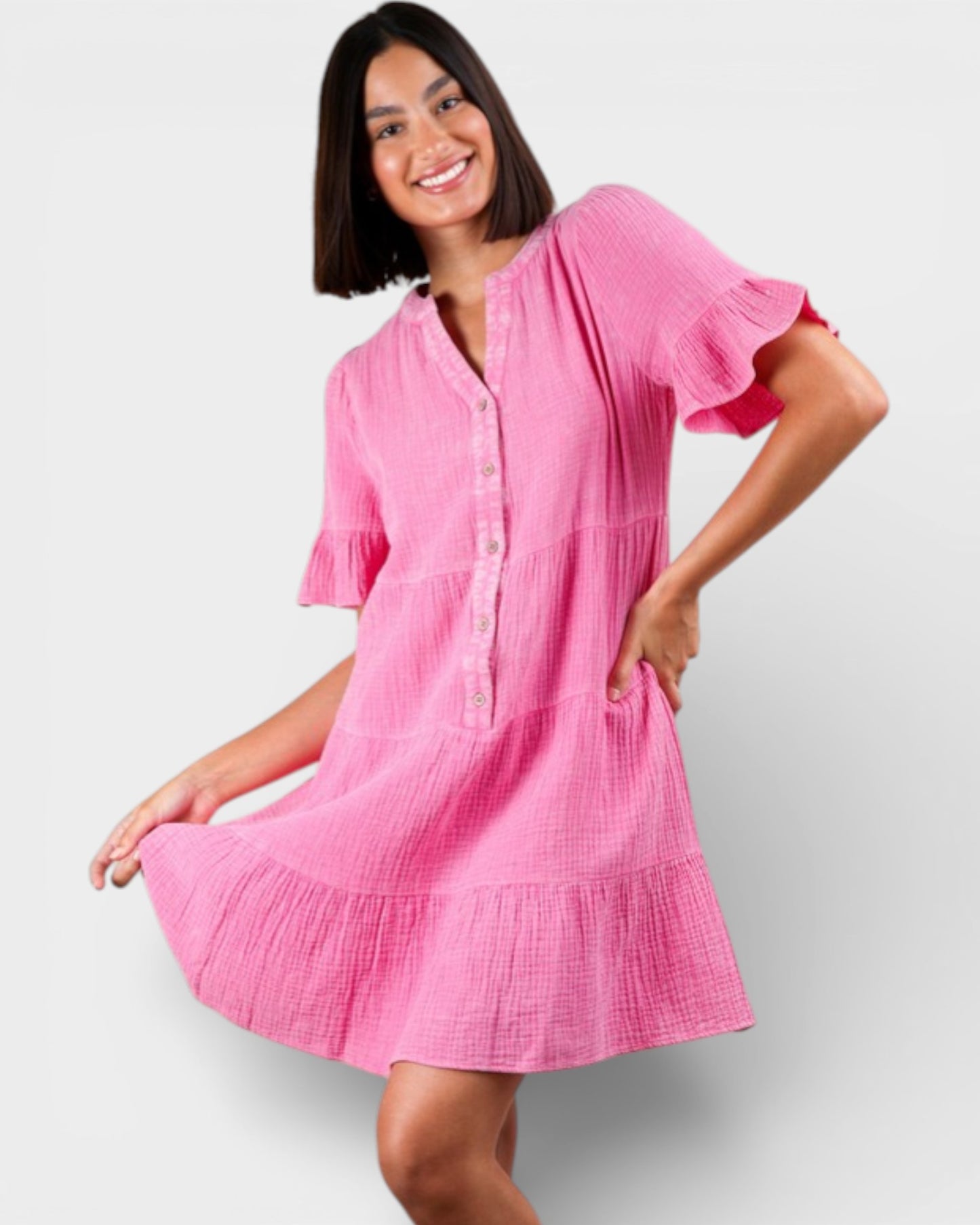 Woman wearing a pink dress on a white background