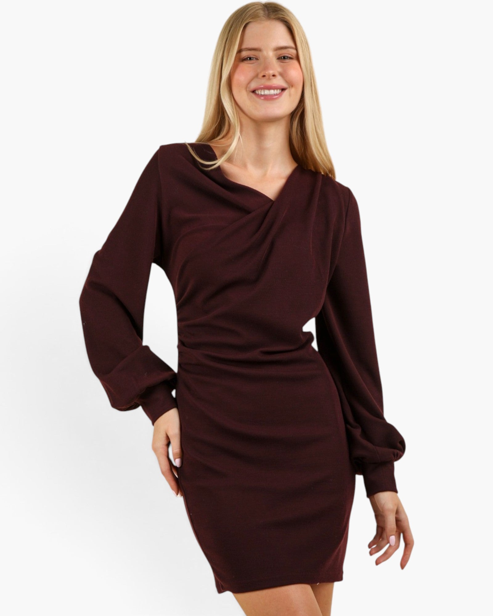 A woman modeling a dark burgundy long-sleeve bodycon dress with a draped cowl neckline, photographed against a clean white studio background.