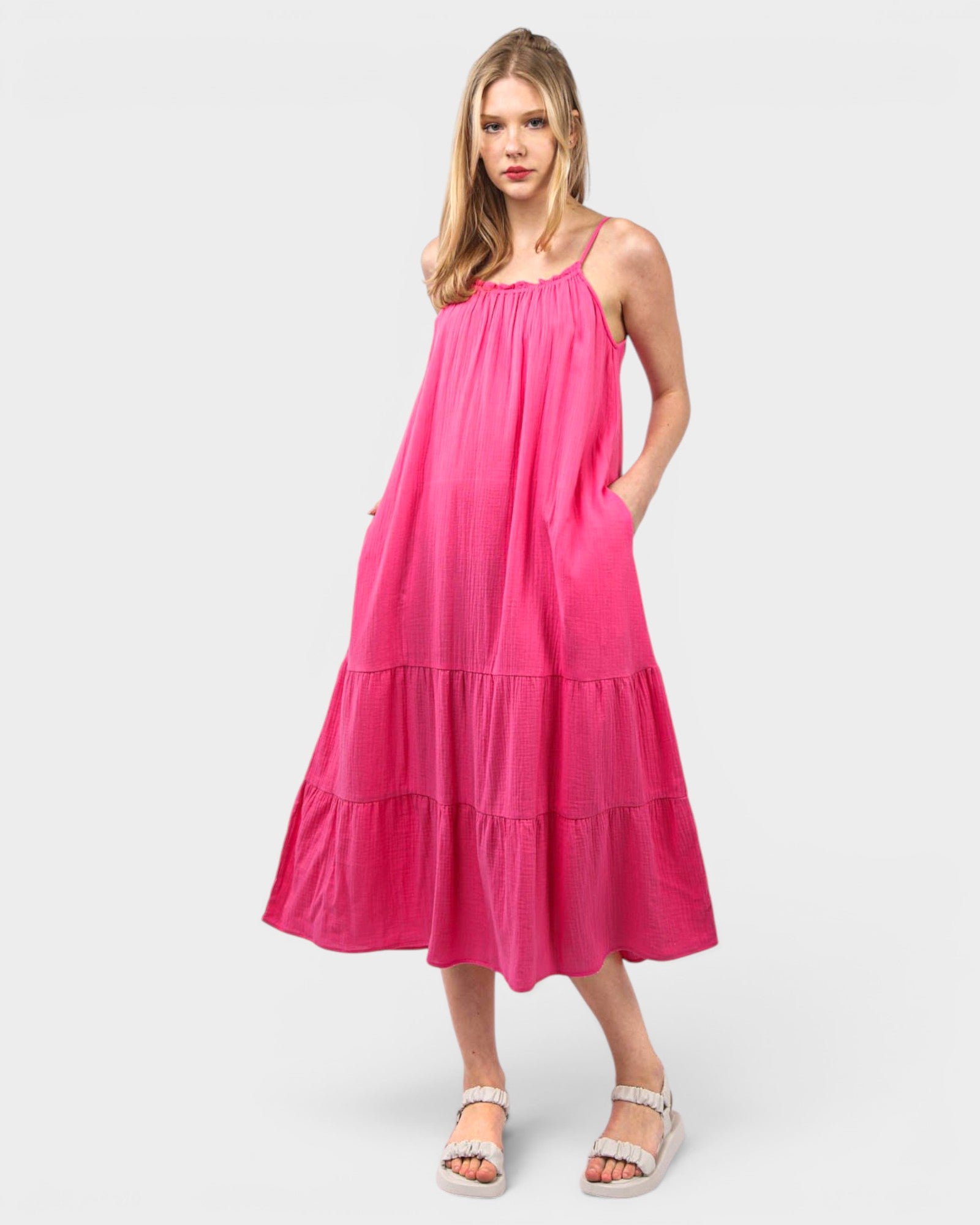 Woman wearing a pink dress on a white background