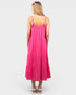 Woman wearing a pink dress on a white background