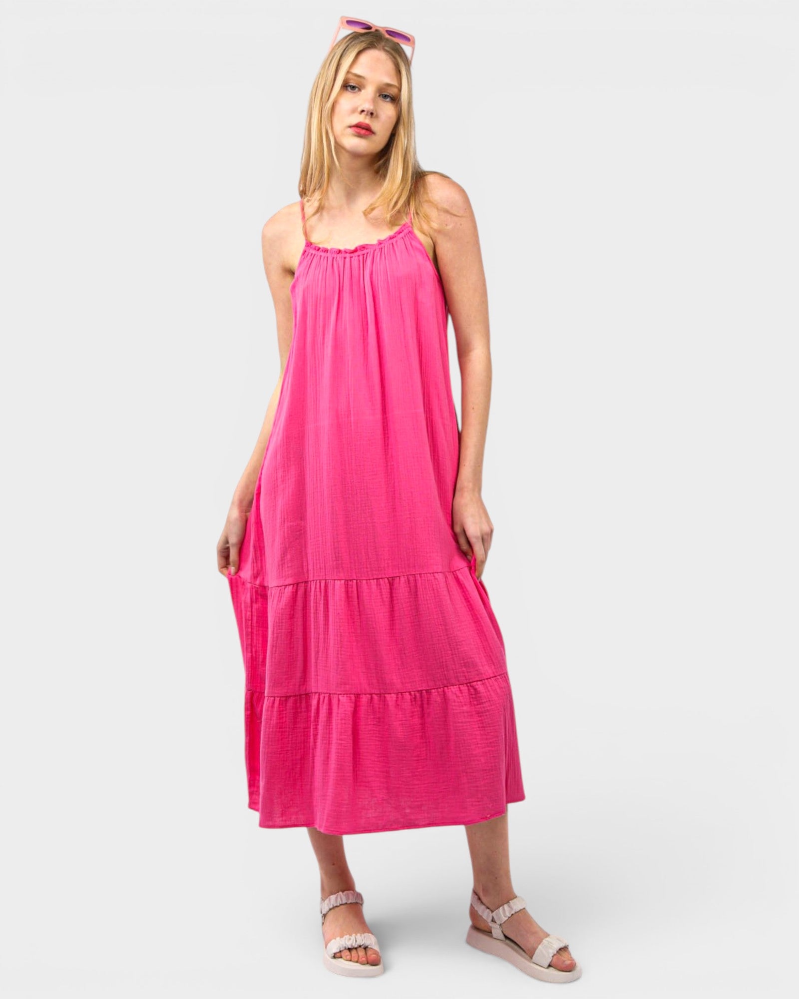 Woman wearing a pink dress on a white background