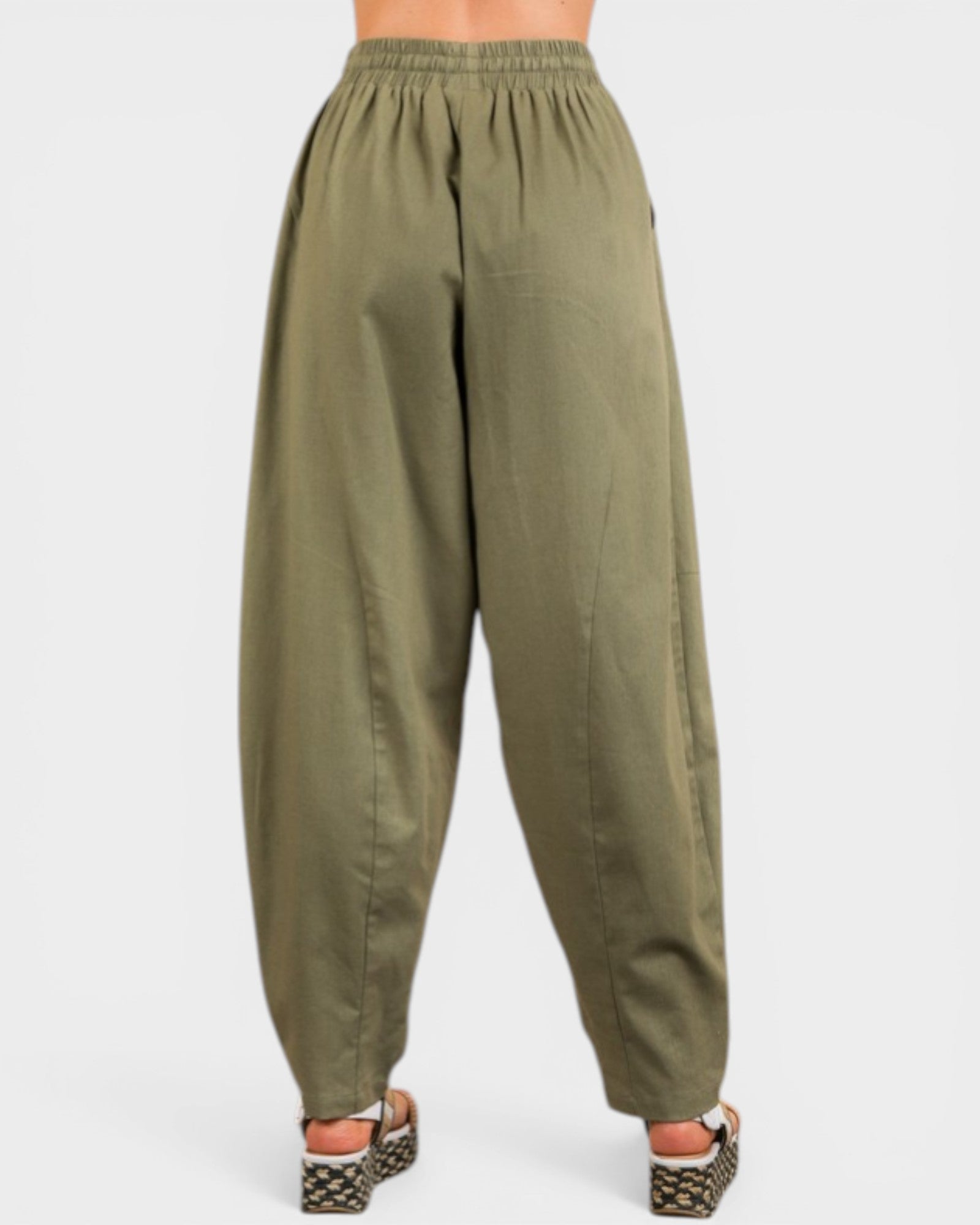Green baggy pants on a white background