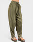 Green pants worn by a person on a white background