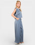 Woman wearing a blue jumpsuit on a white background