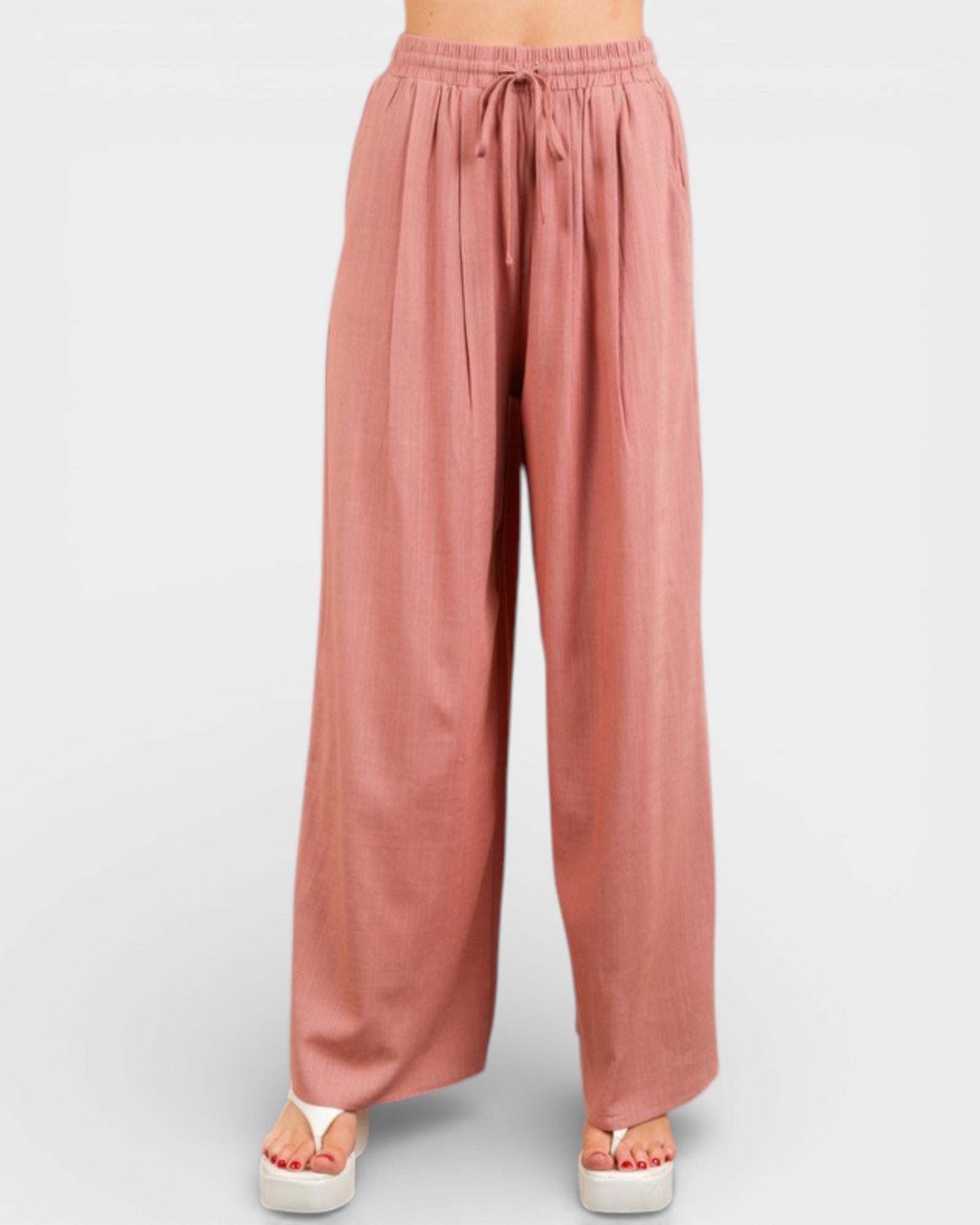 Pink wide-leg pants on a white background