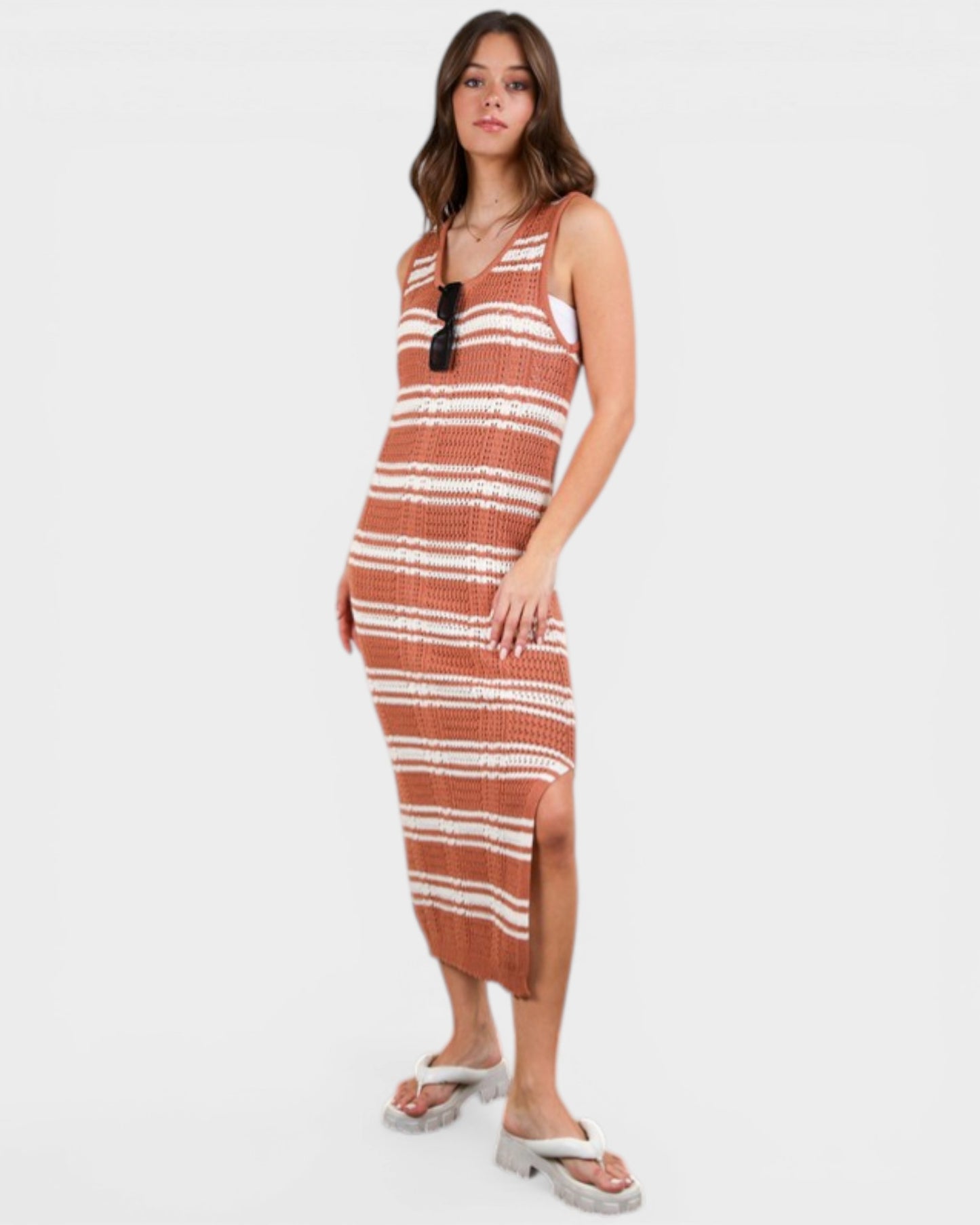 Woman wearing a striped dress on a white background