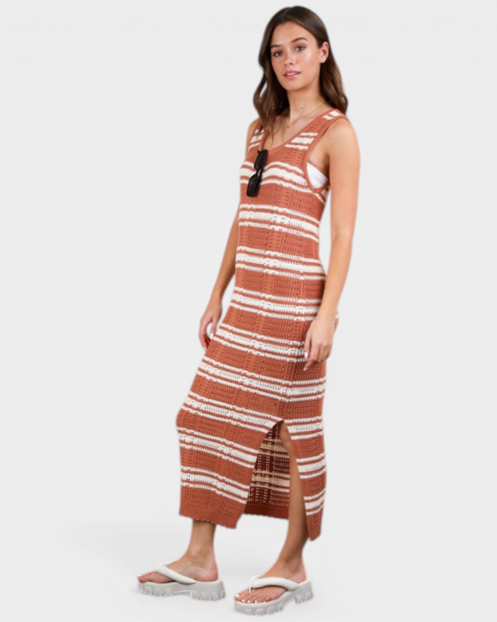 Woman wearing a striped dress on a white background